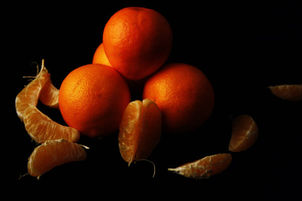 Colin Kay, grade 10, "Simple Still Life," digital photo, 8x10 in. Photo I artists examine Northern Renaissance still life paintings to understand how lighting and careful placement of subject matter can create drama and beauty in a simple still life. In this photo, Colin has demonstrated his understanding of studio lighting and DSLR camera use to create this dramatically lit image.