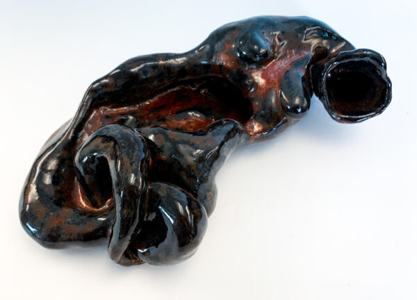 Sara Higger, teacher, "Unraveling," ceramics, 10x3x6 in.