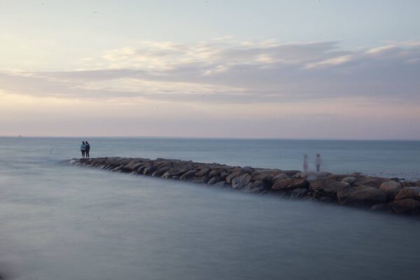 Jetty With Four Figures